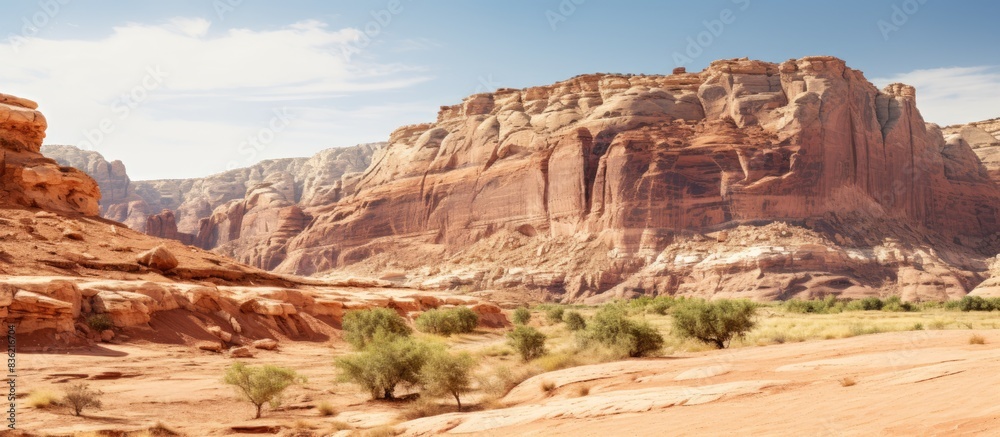 Fototapeta premium A desert rock formation shown on a white background with copy space image.