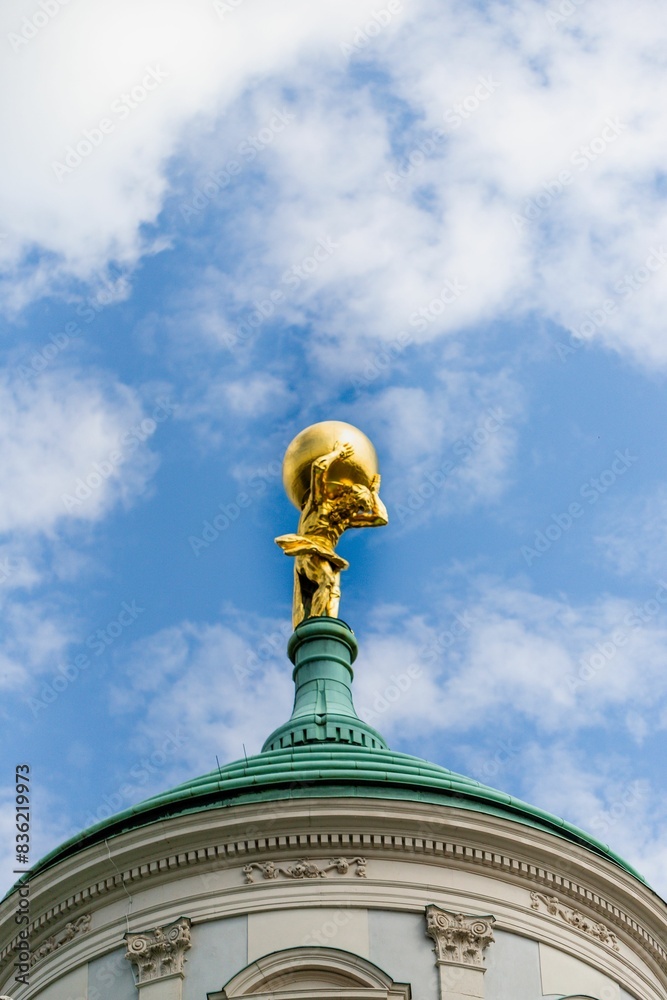 Obraz premium Germany, Potsdam, gold plated Atlas on roof top of old city hall