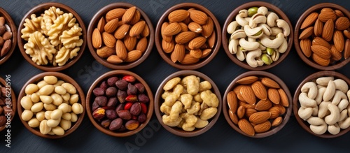 Various nuts arranged on a white backdrop in a photo studio with copy space image.