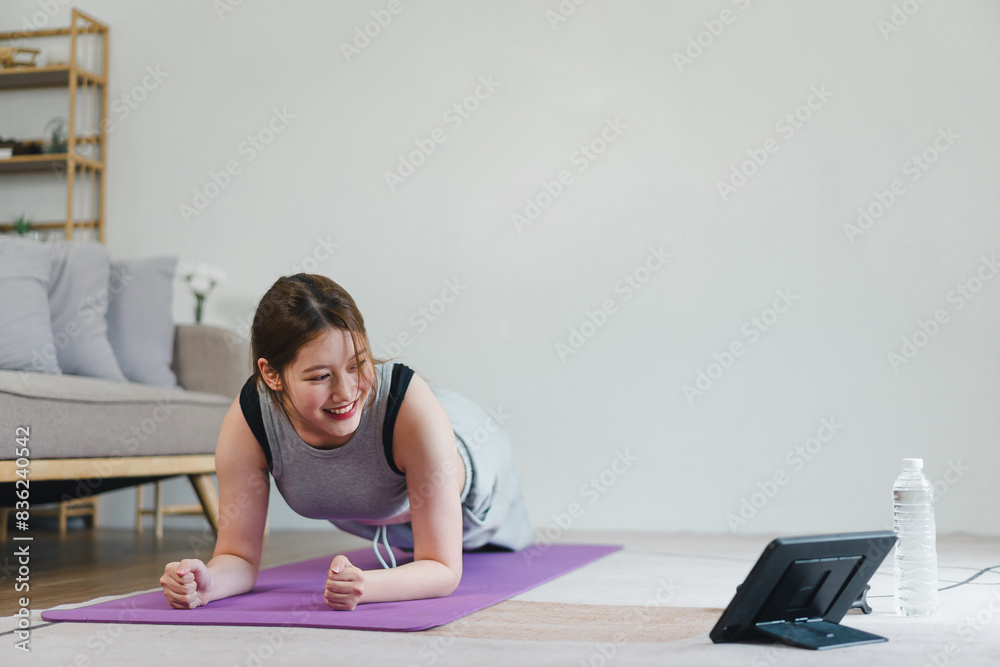 Asian young woman doing plank exercise at home. sport, fitness and healthy lifestyle concept Asian young woman doing plank exercise at home. sport, fitness and healthy lifestyle concept