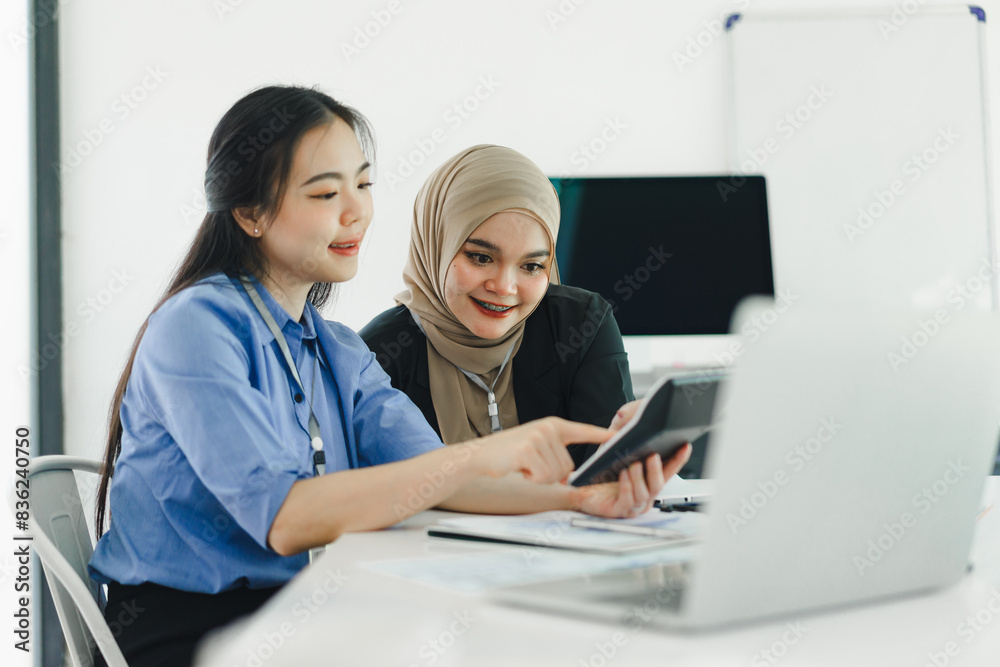 Young diverse people discuss and analyze financial data and marketing strategies, presenting and brainstorming to increase company profits. Young diverse people discuss and analyze financial data and marketing strategies, presenting and brainstorming to increase company profits.