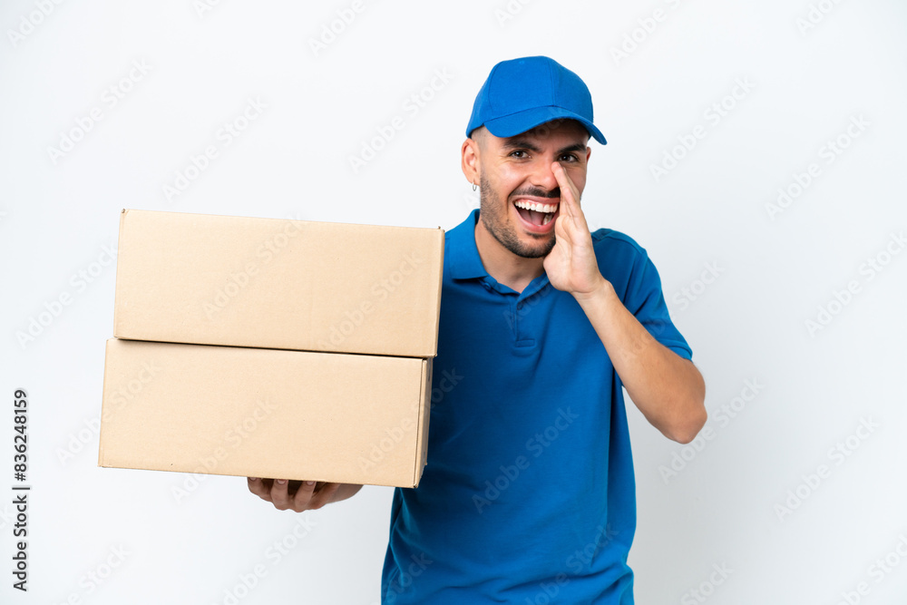Delivery caucasian man isolated on white background shouting with mouth wide open Delivery caucasian man isolated on white background shouting with mouth wide open