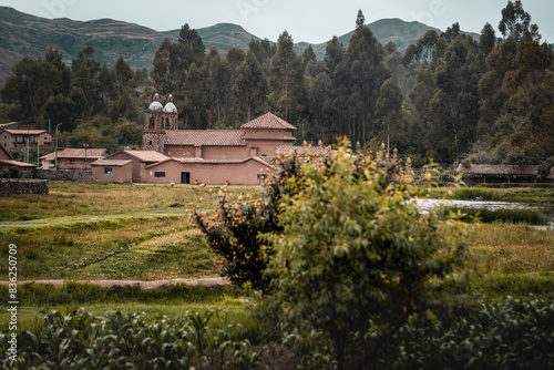 Rural countryside landscape with the small village of Raqchi and its church standing out. This town is famous for its inca archaeological site. Altiplano, Peru, South America photo