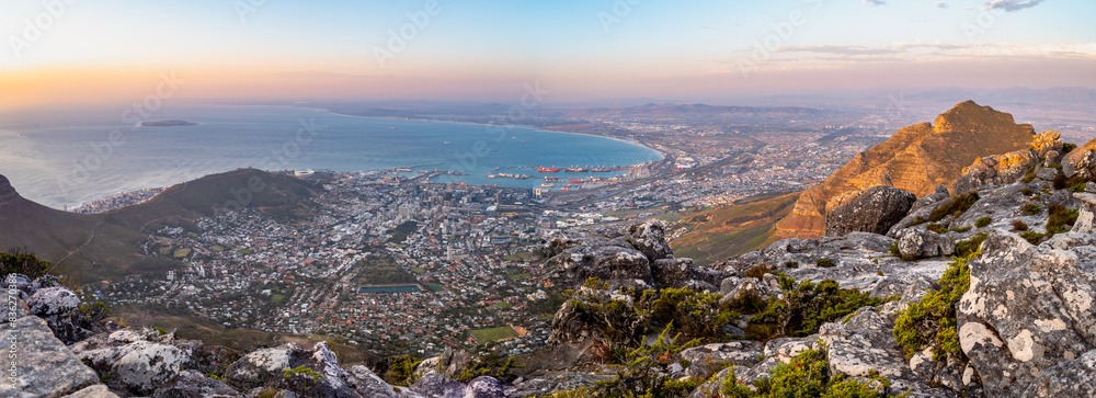 Fototapeta premium A panorama of Cape Town from Table Mountain at sunset, South Africa