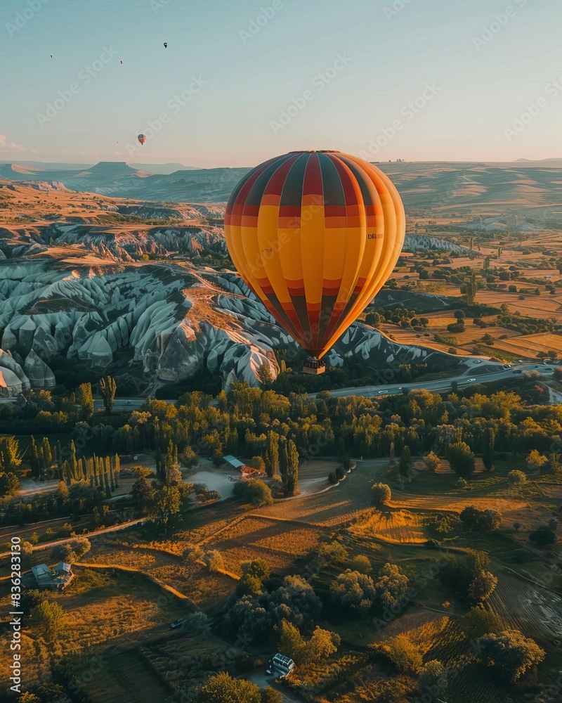 Obraz premium beautiful inspirational landscape with hot air balloon flying in the sky, travel destination