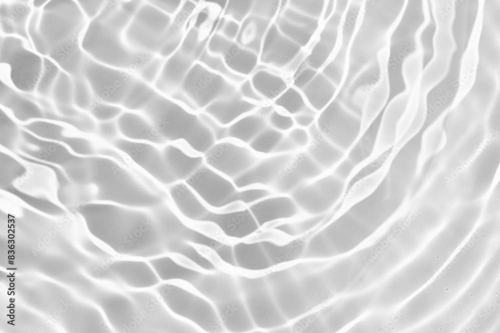 White water surface with ripples, splash and bubbles. Defocused blurred transparent clear white water surface texture. Water waves with shining pattern texture. Summer or spa concept background White water surface with ripples, splash and bubbles. Defocused blurred transparent clear white water surface texture. Water waves with shining pattern texture. Summer or spa concept background