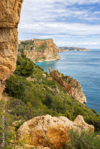 Hiking trail in Benitachell cliffs, from Moraig beach to Llebeig beach in Alicante (Spain) photo