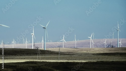 Time lapse of wind turbines on autumn landsape photo