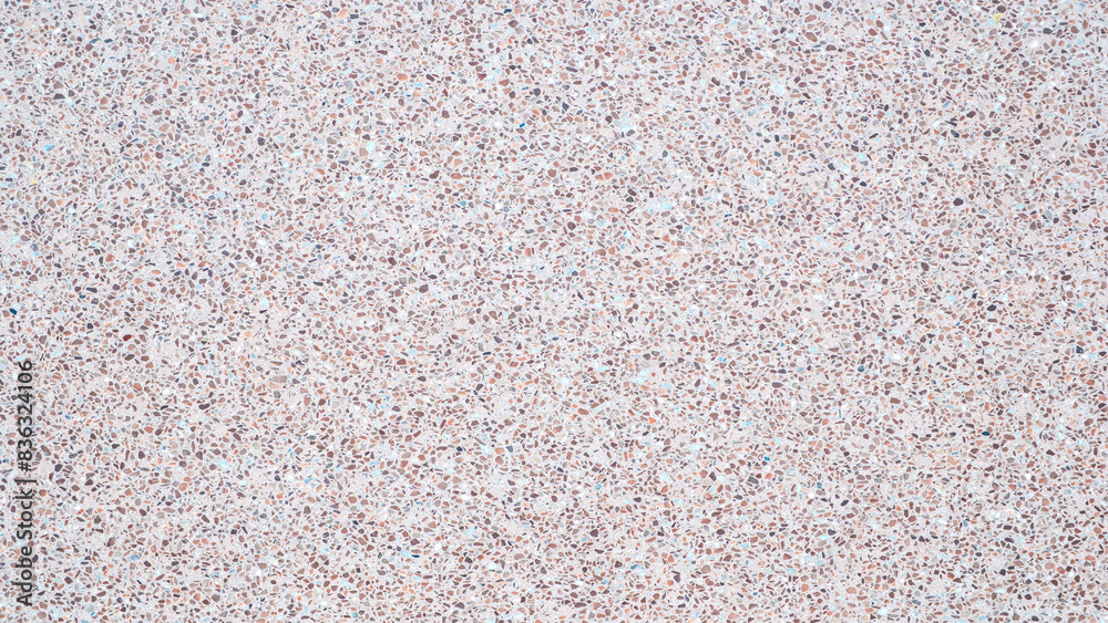 A background with a lot of different colored rocks scattered all over it. The rocks are of various sizes and colors, creating a visually interesting and unique pattern A background with a lot of different colored rocks scattered all over it. The rocks are of various sizes and colors, creating a visually interesting and unique pattern