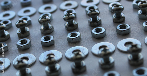 Extreme Closeup Photo Of Rows Made With Shiny Bolts, Washers And Nuts