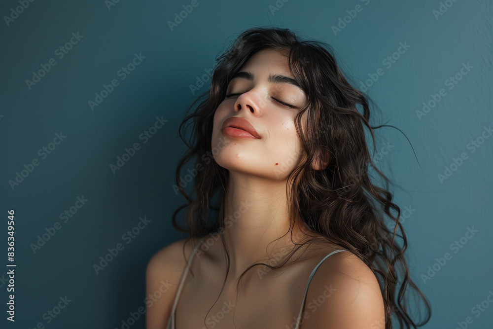 A close up of a woman's face with her eyes closed looking to a side A close up of a woman's face with her eyes closed looking to a side