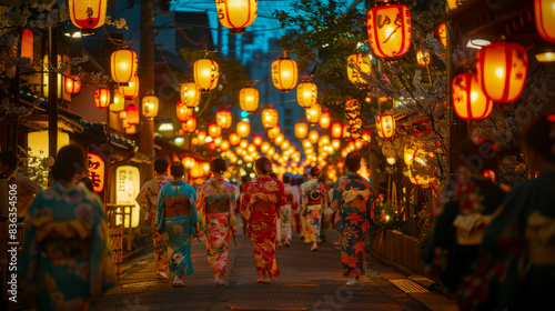 Traditional Japanese Street with Lanterns. Evening view of a Japanese street adorned with glowing lanterns and people in vibrant kimonos, creating a festive atmosphere. Obon festival. © OMGAi