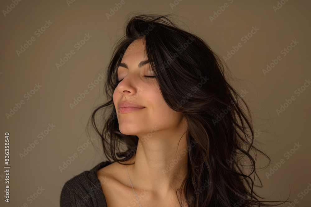 A close up of a woman's face with her eyes closed looking to a side A close up of a woman's face with her eyes closed looking to a side