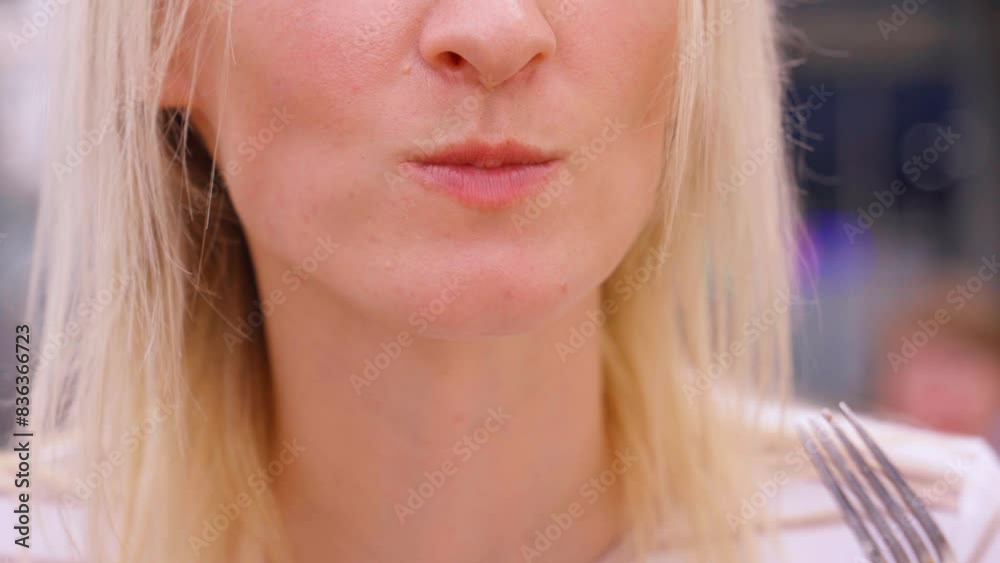 Woman in white clothes eating steak with fork in mouth. Fried chicken steak. Concept of healthy eating, weight loss, weight loss and snacks. woman eating boiled fresh salmon on fork, close up mouth Woman in white clothes eating steak with fork in mouth. Fried chicken steak. Concept of healthy eating, weight loss, weight loss and snacks. woman eating boiled fresh salmon on fork, close up mouth