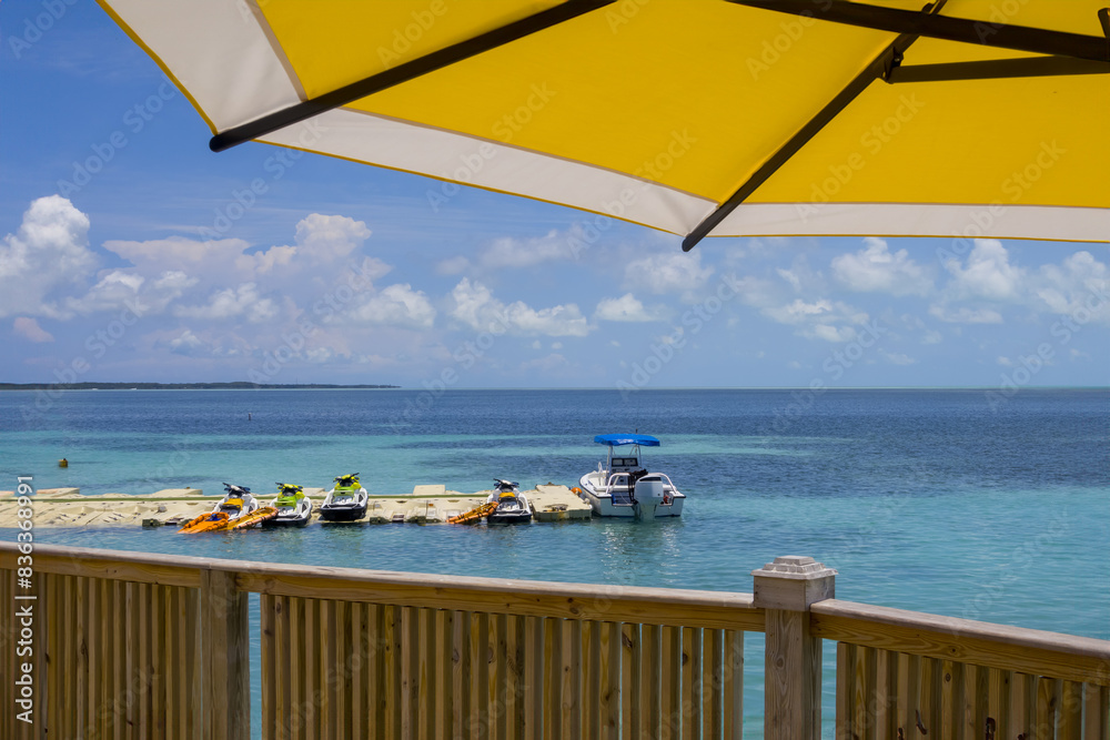 Fototapeta premium Boat and water scooters at the beach side in Caribbean Islands.