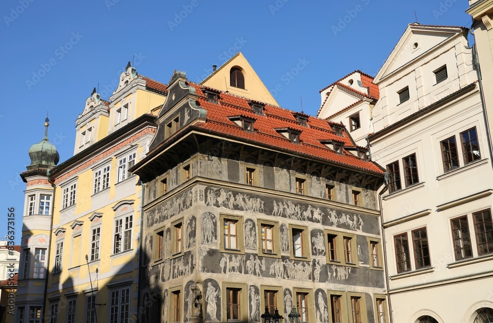 Street with old buildings during the day, one with a terracotta roof. Street with old buildings during the day, one with a terracotta roof.