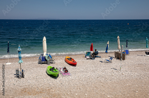 Sundy pebble beach with turquoise crystal clear water in Tyros town, Peloponnese, GREECE in summer. photo