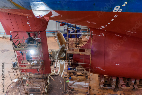 Принти на полотні Cargo vessel in dry dock on ship repairing yard