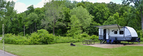 Travel trailer camping in the woods at Mississippi Palisades State Park, Illinois photo
