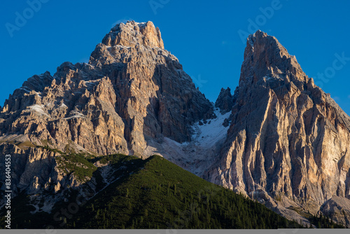 Snow covered peaks and summits of the Mountains in the Dolomites after the first snow of the year - Host of the 2026 winter Olympic Games photo