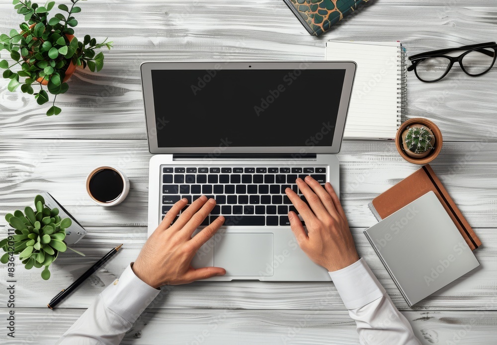 A chic office setup featuring a laptop and various office supplies. A chic office setup featuring a laptop and various office supplies.