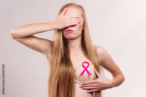 Woman pink cancer ribbon on breast