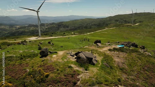 Aerial video above Casa do Penedo Boulder House in Fafe, Portugal
