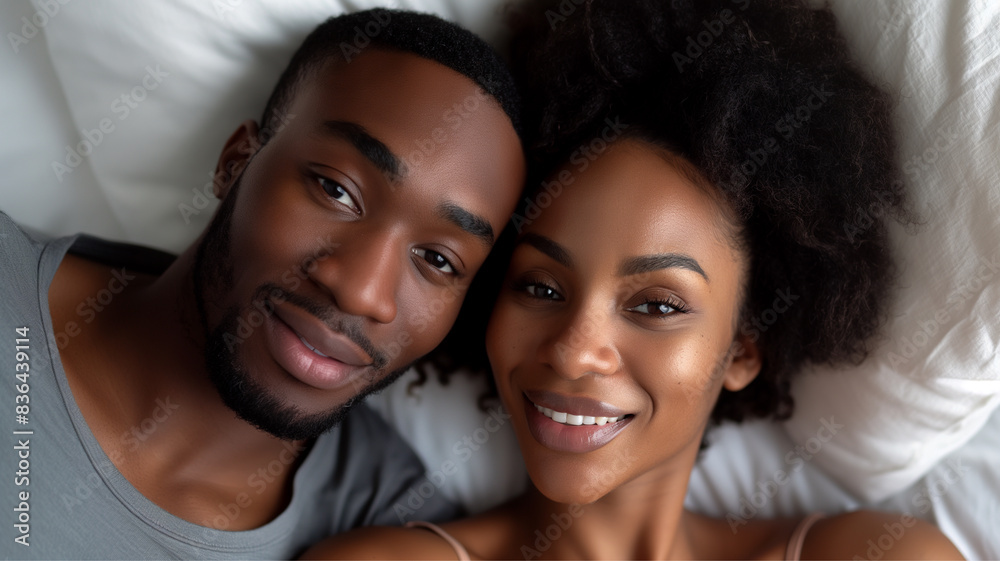 Black couple and eye contact in bed with romance for love with tender, embrace and care in morning with smile. Dating, relationship and relaxing with passion for partner with comfort or waking up