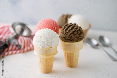 vanilla, chocolate, strawberry ice creams on cone