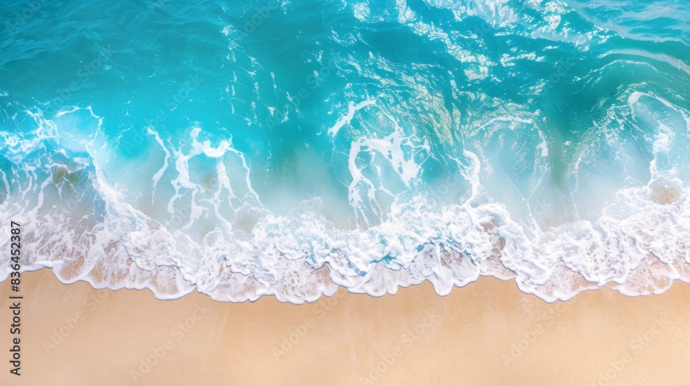 Sandy beach and soft blue ocean wave top view. Summer background Sandy beach and soft blue ocean wave top view. Summer background