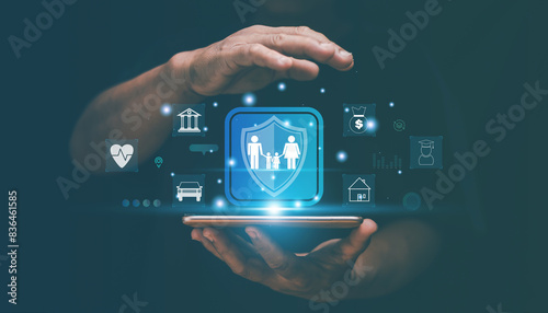 Family life insurance concept, Hands with smartphone for protective gesture insure the family in the future. property, health, car, travel, education, financial. Insurance online for life and family.