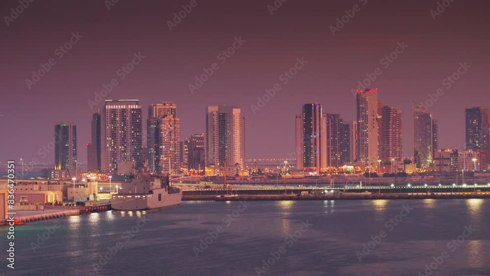 Abu Dhabi, United Arab Emirates - Jan 10 2024, 4k, Panoramic view of skyscrapers cityscape with illuminations and street lights on, at sunset, evening, Abu Dhabi, United Arab Emirates Abu Dhabi, United Arab Emirates - Jan 10 2024, 4k, Panoramic view of skyscrapers cityscape with illuminations and street lights on, at sunset, evening, Abu Dhabi, United Arab Emirates
