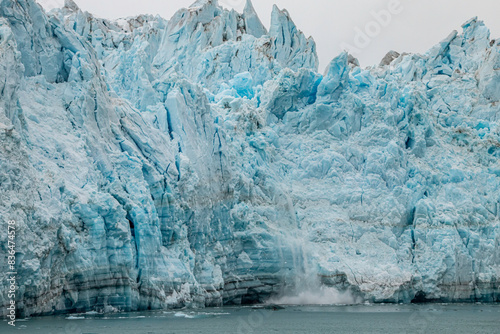 Ice falling from the Hubbard glacier in Alaska