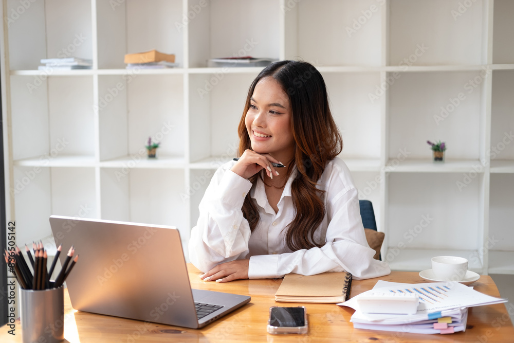Businesswoman using laptop or notebook computer with data analysis graph dashboard, confident woman working with computer laptop concept, contact idea design dashboard graph business conceptual. Businesswoman using laptop or notebook computer with data analysis graph dashboard, confident woman working with computer laptop concept, contact idea design dashboard graph business conceptual.