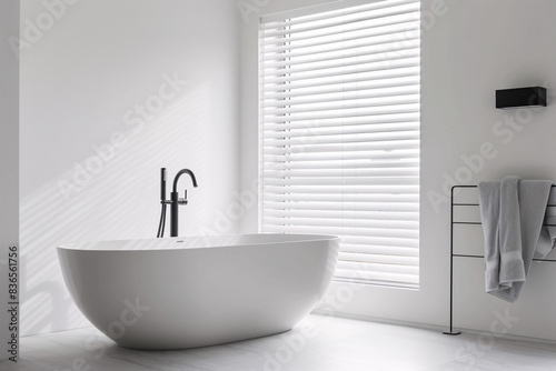 Stylish bathtub in modern style  modern bathtub near white wall in bathroom interior