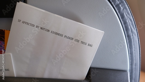 Paper Bag for motion sickness in airplane. photo