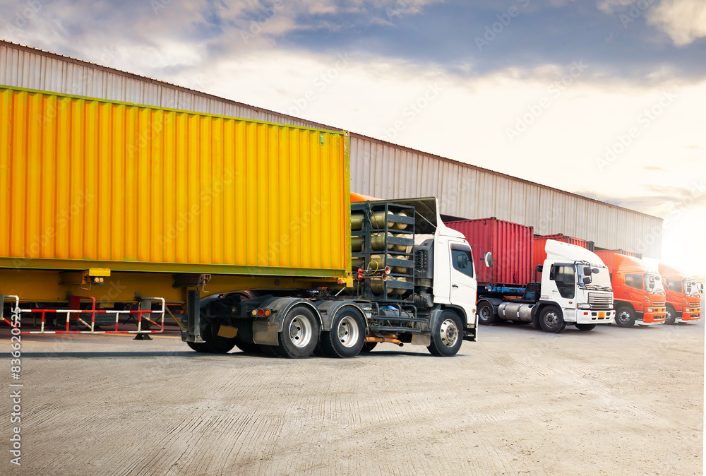 Semi Trailer Trucks on The Parking Lot at Warehouse. Truck Loading Goods at Warehouse. Container Shipping. Tractor Truck. Trucking. Lorry Diesel Trucks. Freight Truck Logistics Cargo Transport.