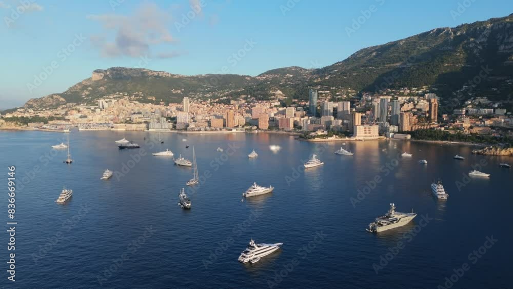 Aerial of boats in the sea in Monte Carlo, Monaco with buildings in the background Aerial of boats in the sea in Monte Carlo, Monaco with buildings in the background