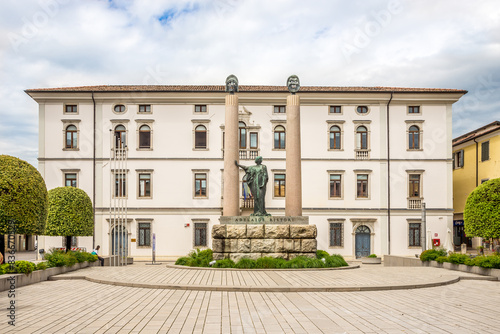 Monument wit Library building in the streets of Cividale del Friuli - Italy photo