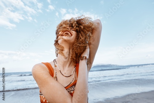 Beach Woman: Smiling Traveler in Hippie Lifestyle, Embracing Freedom and Nature photo