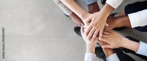 Top view of business people hands together in team unity and support on grey background with copy space. High quality, professional photo, sharp focus, high resolution, shot in the style of Canon EOS.