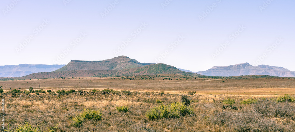 Mountain range in the Karoo with shrubs growing Mountain range in the Karoo with shrubs growing