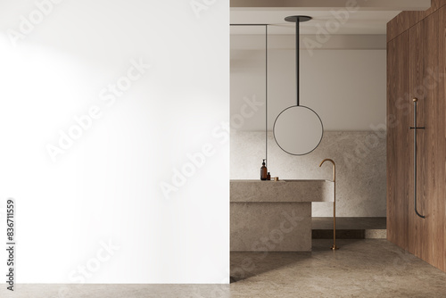Modern bathroom with marble fixtures, light brown wood paneling, and an empty white wall on the left, light background, mockup concept. 3D Rendering