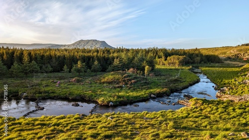 Obraz na płótnie Beautiful landscape scenery with green hills, river and mountains at Connemara National park in County Galway, Ireland w salonie