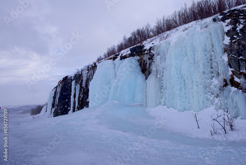 фотографія Large frozen waterfall in Abisko National Park, Abisko, Sweden