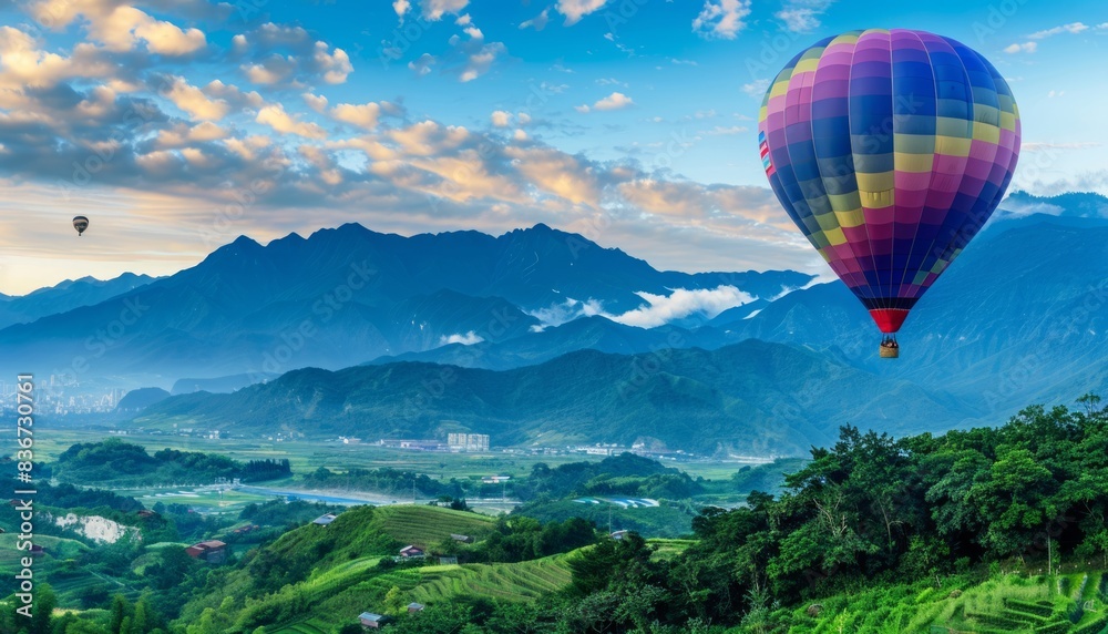Fototapeta premium Vibrant Hot Air Balloon Soars over Spectacular Mountain Views at Cingjing Farm, Nantou, Taiwan