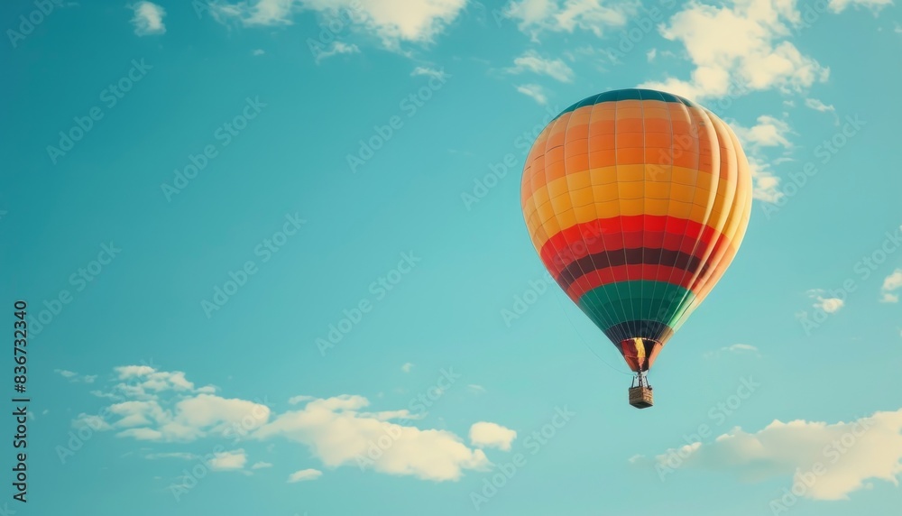 Naklejka premium Vibrant Journey: A Colorful Hot Air Balloon Adventure in the Skies