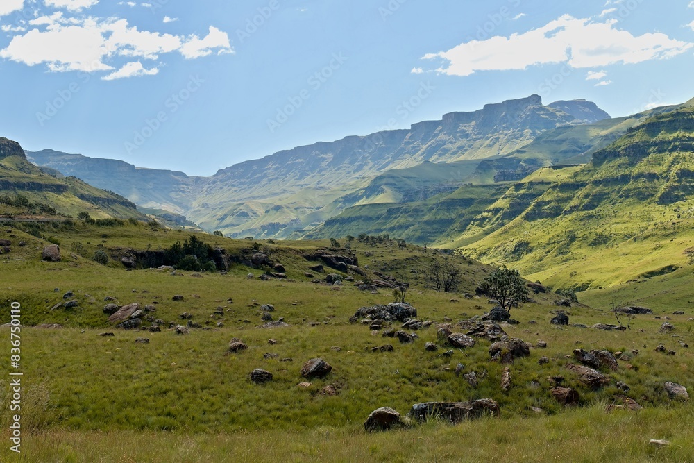Obraz premium Driving view from Sani Pass (2,876 meters) to the rock formations of the Twelve Apostles in the Drakensberg Mountains and the landscape of KwaZulu-Nathal province. Republic of South Africa. Africa.