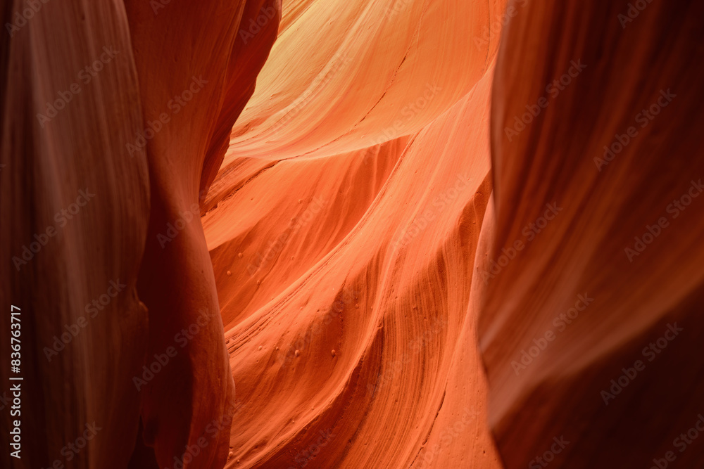 Orange coloured rocks in Antelope Canyon, Arizona, USA. Abstract background. Wallpaper and website concept.