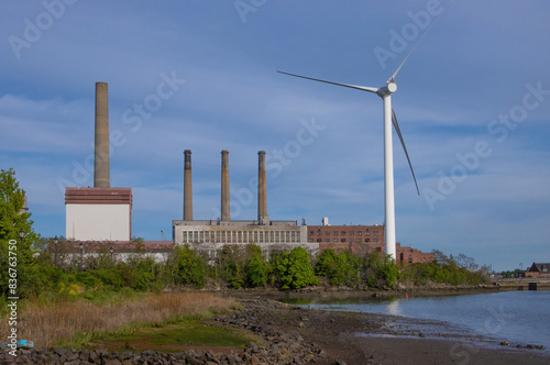 Old fossil fuel power station and wind turbine at the Mystic River, Boston